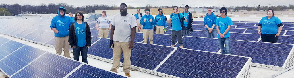Great Lakes CCC students installing solar panels